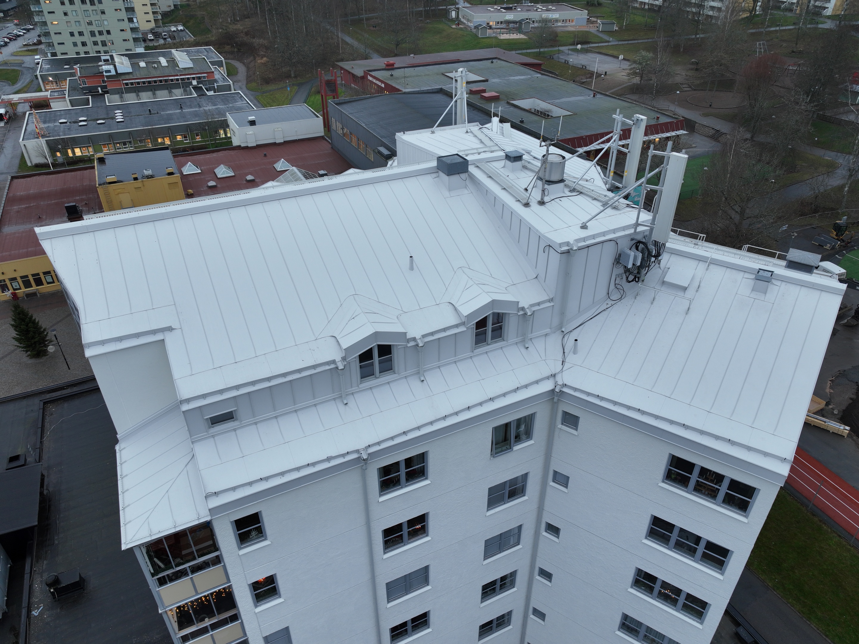 a view of a kitchen through a wire fence